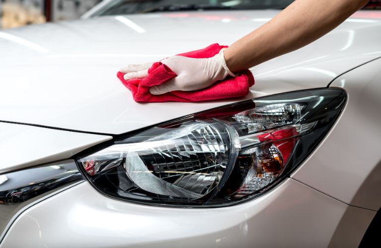 Hand of a man cleaning a vehicle