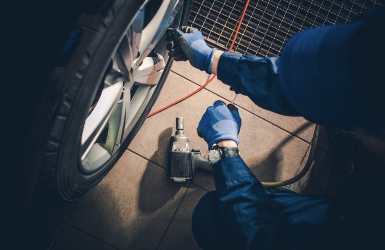 Hands of a mechanic cleaning a vehicle